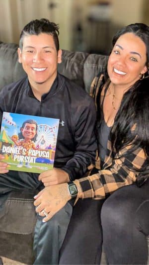 Adult smiling while holding their personalized heartfelt book from Lovabook